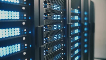 Data servers with blinking blue lights in a data center. - Powered by Adobe