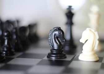 chess pieces on the chess board artistic background game playing competition	
