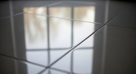 Reflection of a window with a grid pattern on a glossy floor