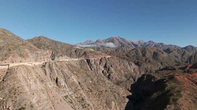 Aerial footage of Ruta 40 winding through Cuesta de Miranda mountains in La Rioja Province, Argentina.