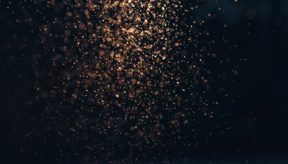 Abstract dark background with shimmering golden particles creating a magical and ethereal bokeh effect.