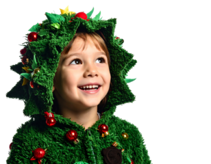 A young child with brown hair and rosy cheeks beams happily, wearing a green hooded Christmas tree costume. Black background