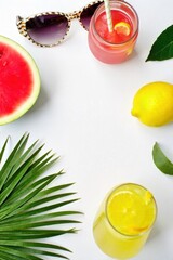 Vibrant Summer Sale Display Tropical fruits, cool drinks, and beach accessories arranged attractively. A vibrant, top down flat lay of summer sale items. Include a half cut watermelon, a pineapple, a