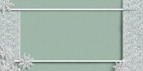 A white frame with snowflakes on a green background