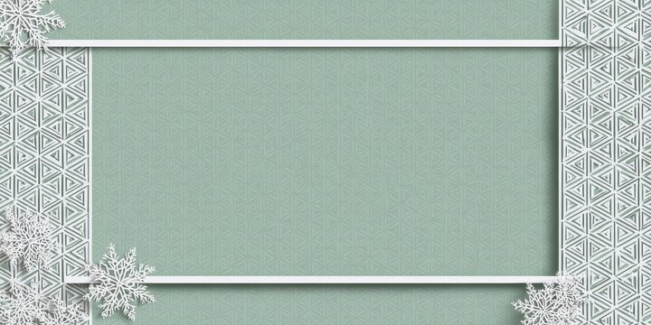 A white frame with snowflakes on a green background