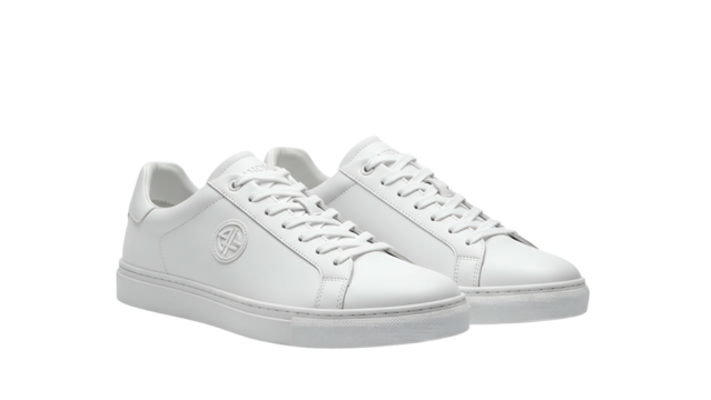 Pair of immaculate white leather athletic footwear displayed against a dark background