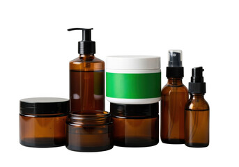 Amber glass skincare bottles and jars grouped for beauty product photography transparent background