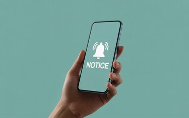 Hand holding smartphone with notification bell and notice icon