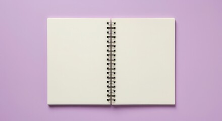 Open spiral bound notebook displays blank cream colored pages atop a pastel lavender background.
