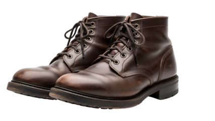 Sturdy brown leather lace up work boots displayed against a black background