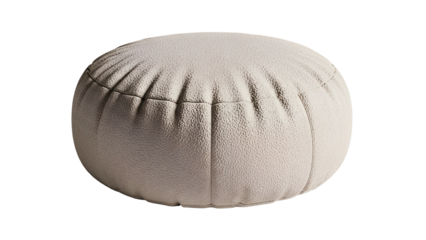 Round light colored cushion rests isolated against a completely dark background