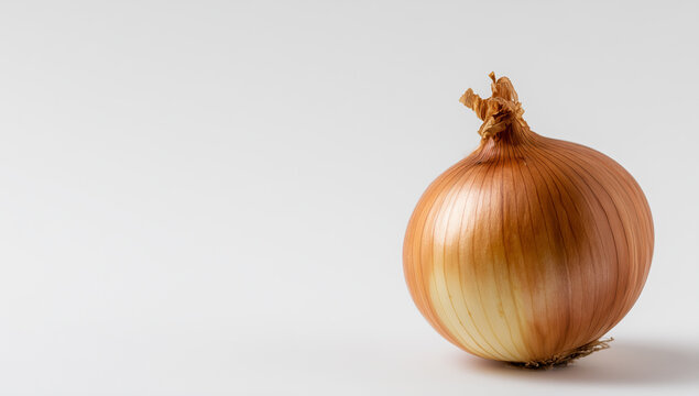 Fresh orange onion on a gray surface ready for cooking or eating