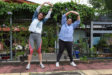 Slim and Plus size woman with sport jacket walk exercise outdoor, wellness lifestyle, wellness and healthy lifestyle