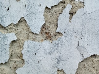 Aged and Textured Wall Surface Peeling Paint Reveals Cement