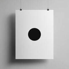 Minimalist white poster with a central black circle graphic hanging on a gray wall with binder clips.