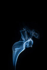 Blue hot curly steam smoke isolated on black background. Abstract background, design element, for overlay on pictures. Create mystical Halloween photos, for overlay on pictures.
