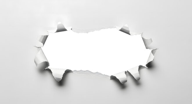 Horizontal tear hole in the center of a clean white sheet of paper