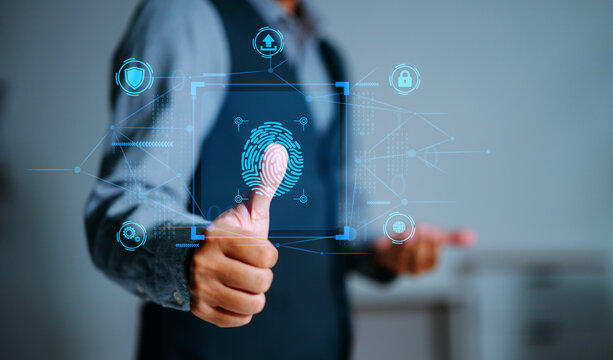 A man scanning his fingerprint on a biometric digital interface, representing secure access, identity verification, and advanced cybersecurity technology.