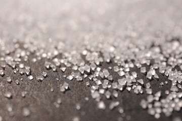 Close-up of the surface of white salt grains, macro salt