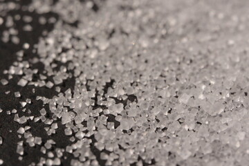 Close-up of the surface of white salt grains, macro salt