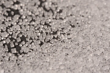Close-up of the surface of white salt grains, macro salt
