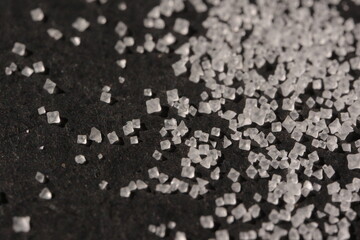Close-up of the surface of white salt grains, macro salt