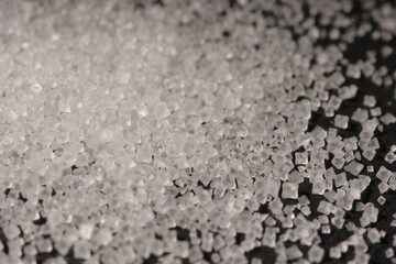 Close-up of the surface of white salt grains, macro salt