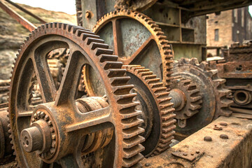 Rusty corroded gears and cogwheels with industrial machinery decay closeup view