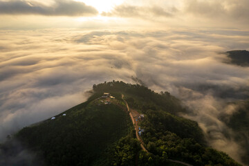 Landscape of Morning Mist with Mountain Layer. mountain ridge and clouds in rural jungle bush forest