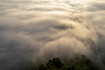 Landscape of Morning Mist with Mountain Layer. mountain ridge and clouds in rural jungle bush forest