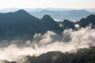 Landscape of Morning Mist with Mountain Layer. mountain ridge and clouds in rural jungle bush forest