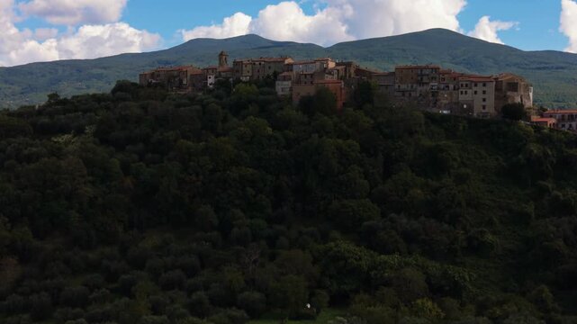 Historic hilltop village Montegiovi, Tuscany. Stone buildings, green valleys and Monte Amiata aerial