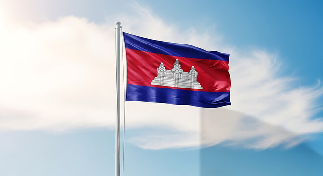 The national flag of cambodia waving proudly against a bright blue sky with soft clouds