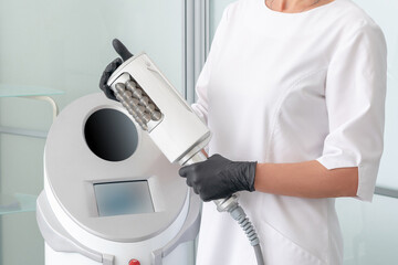 cosmetologist standing in rubber gloves doing endospheres therapy
