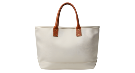 A stylish white tote bag with brown leather handles, perfect for beach or everyday use, isolated on transparent background