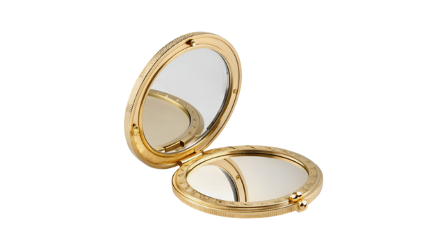 An elegant gold compact mirror is open revealing its dual mirrors The ornate round case has intricate texturing and a detailed finish perfect for personal grooming