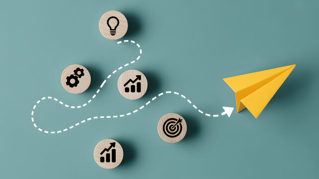 Creative journey to success with paper airplane and wood blocks showing goals