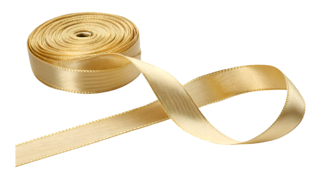 A shiny golden ribbon unspools from its roll forming an elegant twist