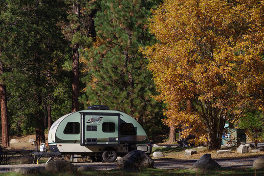 Yosemite National Park, California, United States - November 3, 2025: Parked R-pod shown at a campground in Yosemite against fall foliage.