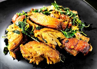 Stir-fried roasted duck with basil in plate, Thai famous food.