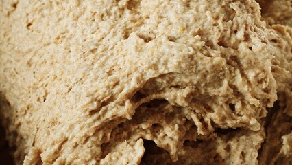 Close-up of rising gluten-free sourdough bread dough. Texture, air bubbles and fermentation process. Traditional recipe made from rye flour. Craftsman, cooking, bakery, culinary or bakery background