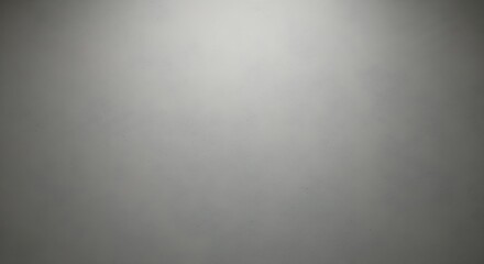Subtle vignette on a gray wall, creating a soft and diffused light effect
