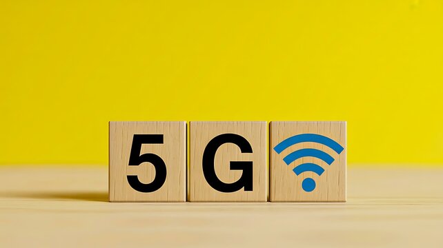 Wooden blocks displaying 5g text and wifi symbol on bright yellow background
