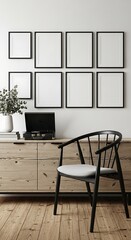 Fototapeta premium Modern minimalist room with a wooden credenza, a black chair, and a gallery wall of empty frames against a white wall
