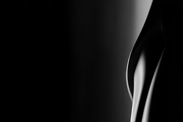 Monochrome abstraction with sleek curve, light reflecting on surface