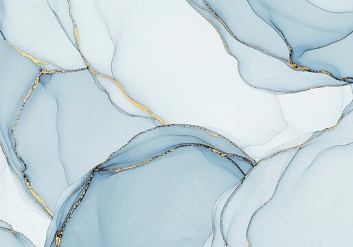 Abstract fluid art background featuring swirling pale blue and gray alcohol ink with luxurious metallic gold veins tracing the edges