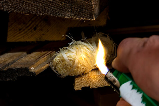 The high flammability of the waxed fiber allows immediate ignition, which then transfers heat to adjacent logs to sustain the fire. selective focus