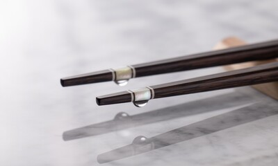 Elegant chopsticks with water droplets