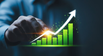 A person's hand guides a growing financial graph, symbolizing business success, profit increase, and market expansion in a digital environment.