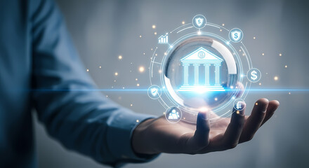 A person's hand presents a glowing bank icon, symbolizing digital banking, financial technology, and secure online transactions.